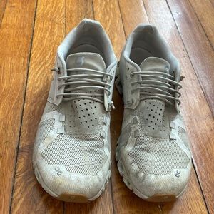 On cloud running shoes. Very worn but still in good condition. No rips or tears